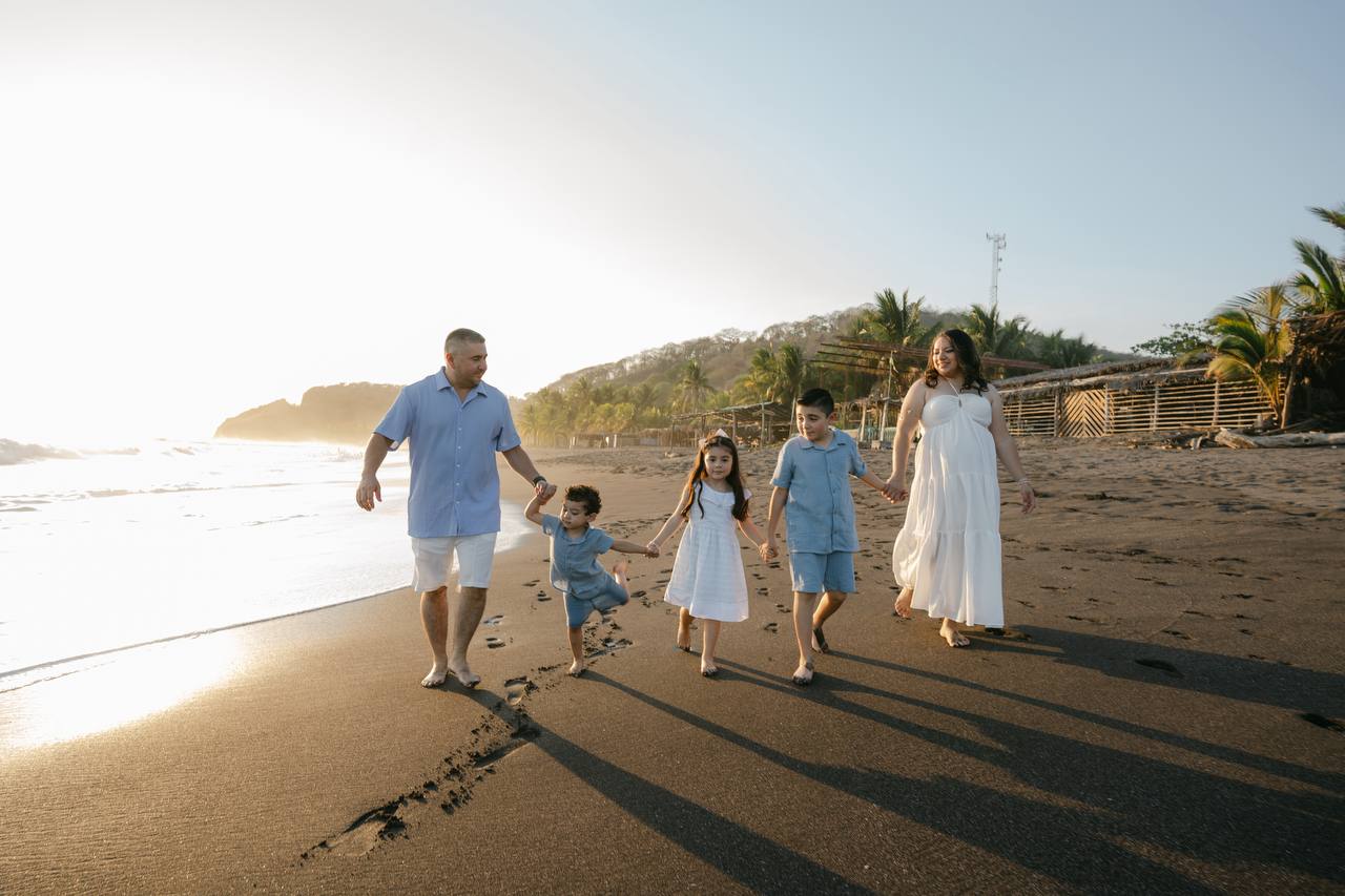 Family walking at sunset