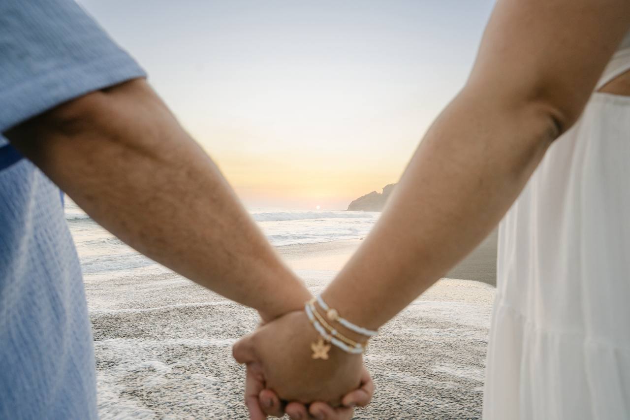 Holding hands at the beach